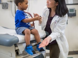 Dr. Jane Fan examines a patient