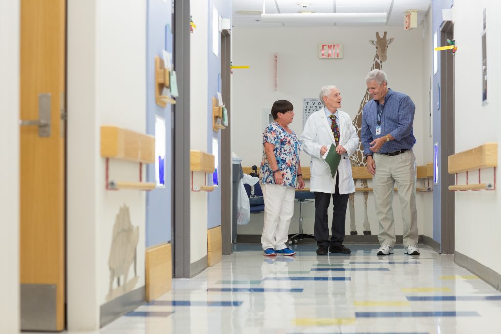 Members of the Child Neurology team in the clinic hallway