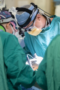 Military neurosurgeon Dr. Brian Sindelar in the OR