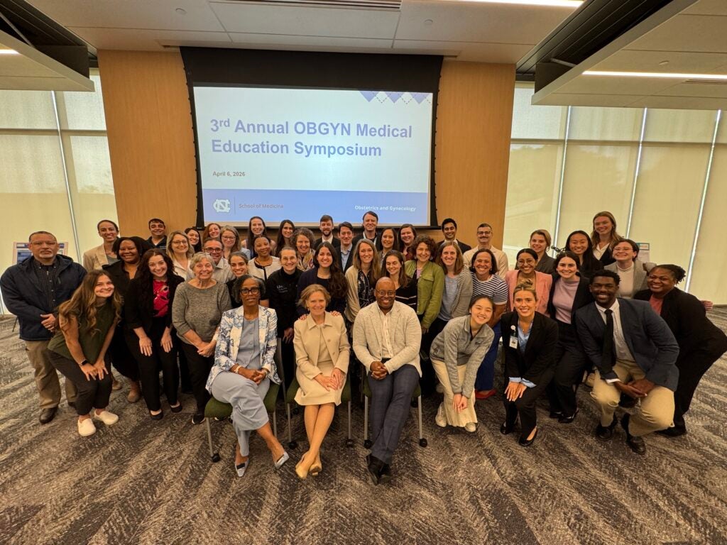 UNC Faculty pictured with all presenters and poster participants.