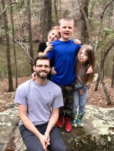 Photo of Jared Lowe with nieces and nephew