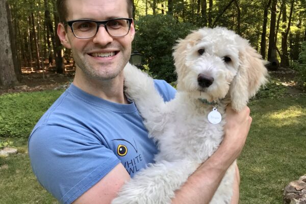 Photo of Jared Lowe with his dog Birgie