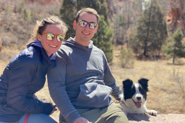 Photo of Lauren Baumgardner and her partner with their dog