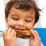 Boy Eating sandwich