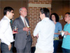 Dr. Sharp talks with students at reception