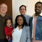 Evan DuBose, PhD with mentors and family