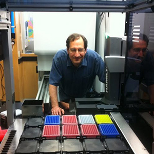 Bryan Roth peeks inside the PDSP robotic instrument