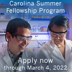 Two scientists at a lab bench with the words: Carolina Summer Fellowship Program - Apply now through March 4, 2022."