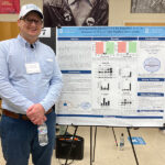 Carolina Summer Fellowship Program 2020 Student poster presentations: Cody White stands with their poster.