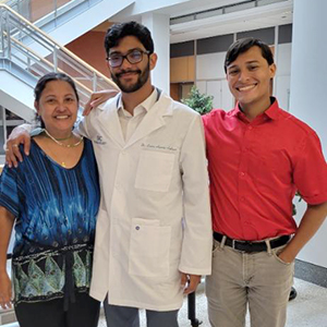 Dr. Lucas Aponte-Collazo with his mother and brother at PhD defense