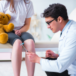 physician examining young patient