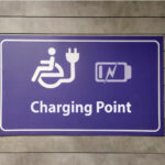 Sign illustrating charging station for wheel chair battery