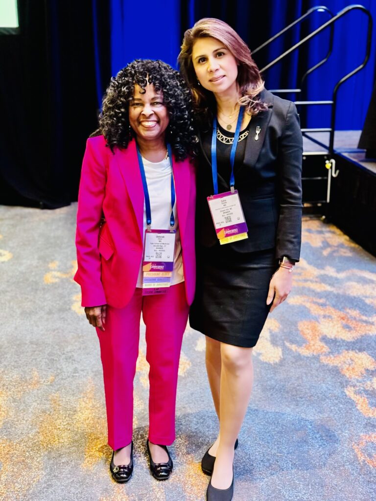 Dr. Saira Sheikh photographed at ACR23 with Dr. Deborah Desir, incoming president of the ACR.