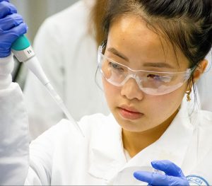Example image of medical student working in a lab.